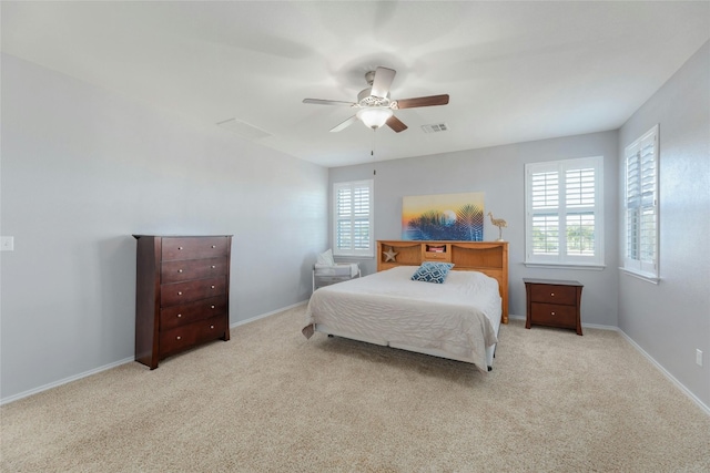 bedroom with light carpet and ceiling fan