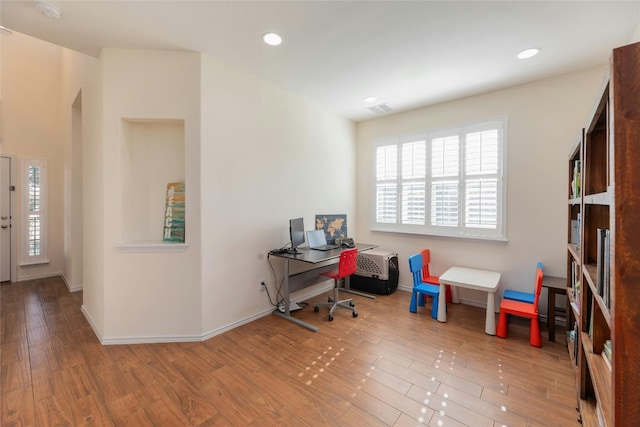 office space with hardwood / wood-style floors