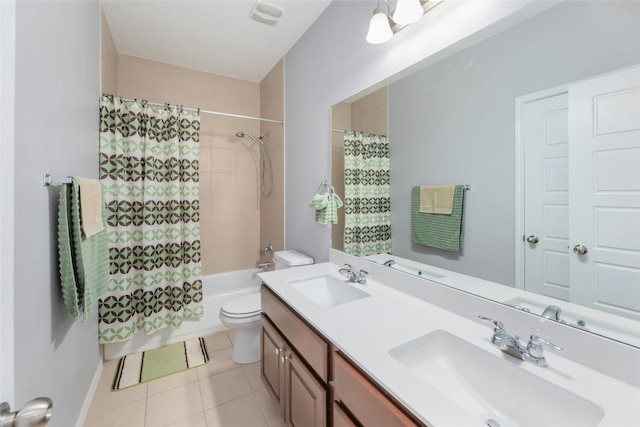 full bathroom featuring tile patterned flooring, vanity, shower / bath combination with curtain, and toilet