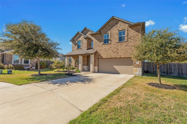 view of front of house with a garage and a front lawn