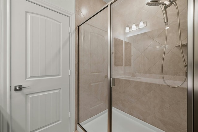 bathroom with a shower with shower door