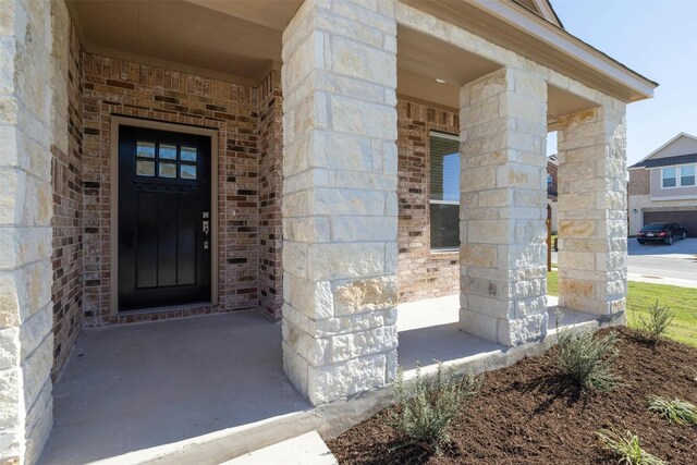 3601 Lapio Way, Round Rock, TX 78665 - property entrance featuring brick siding and stone siding