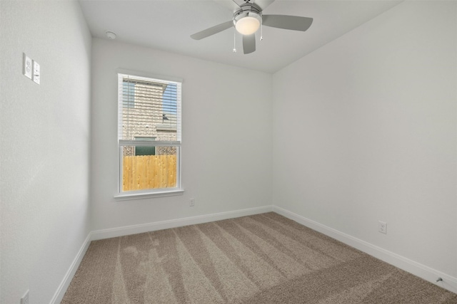 empty room with carpet and ceiling fan