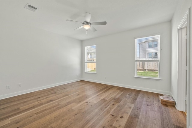 unfurnished room featuring light hardwood / wood-style floors and ceiling fan