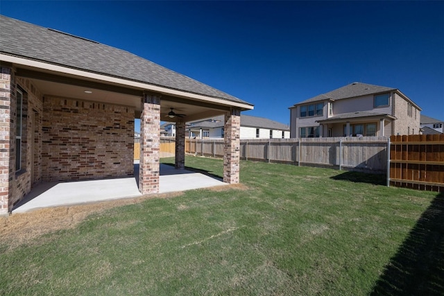 view of yard with a patio and ceiling fan