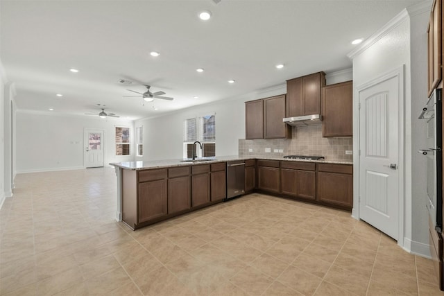 kitchen featuring backsplash, crown molding, sink, light stone counters, and stainless steel appliances