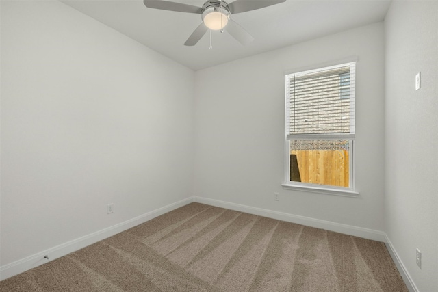 empty room with carpet flooring and ceiling fan