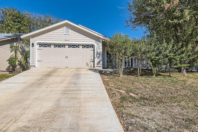 single story home featuring a garage