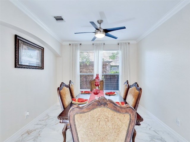 dining room featuring ceiling fan and crown molding