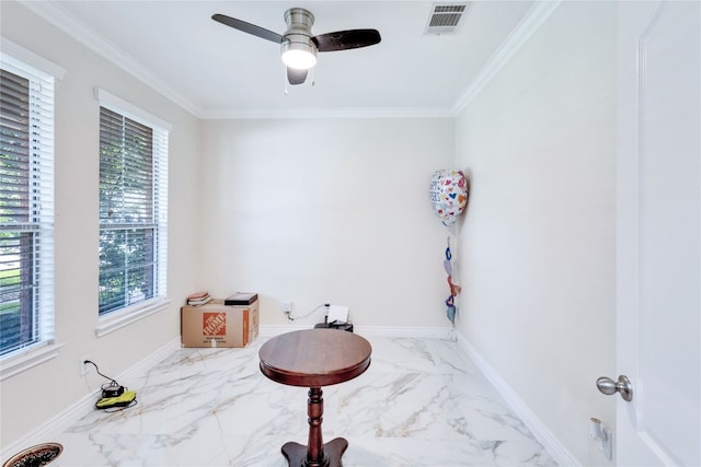 interior space featuring ceiling fan and ornamental molding