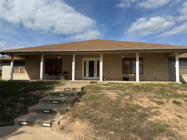 rear view of property featuring french doors