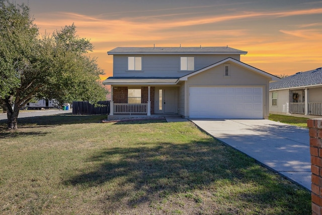 3104 Tyler Ln, Taylor, TX 76574 - traditional-style house with covered porch, a garage, a yard, and concrete driveway