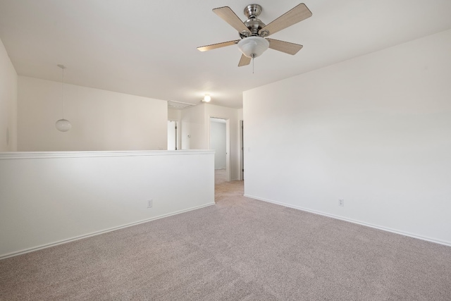 empty room with ceiling fan and light colored carpet