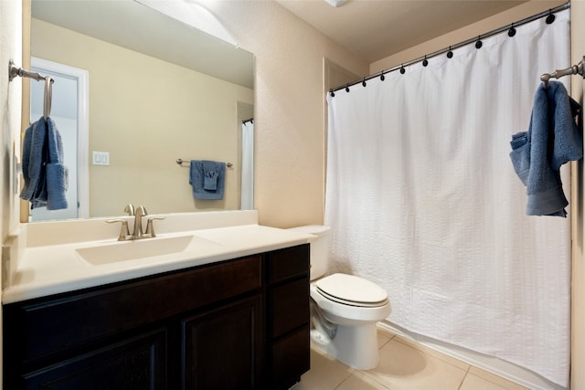 bathroom with tile patterned floors, vanity, and toilet