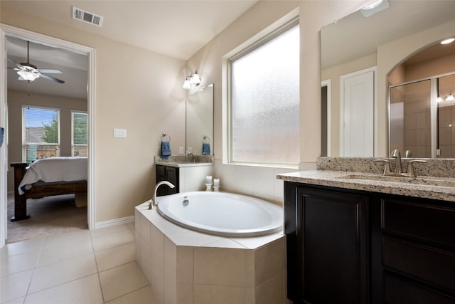 bathroom with tile patterned floors, ceiling fan, vanity, and independent shower and bath