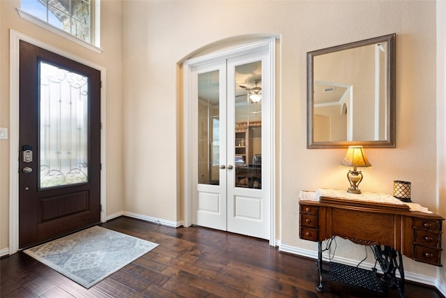 entryway with dark hardwood / wood-style flooring and french doors