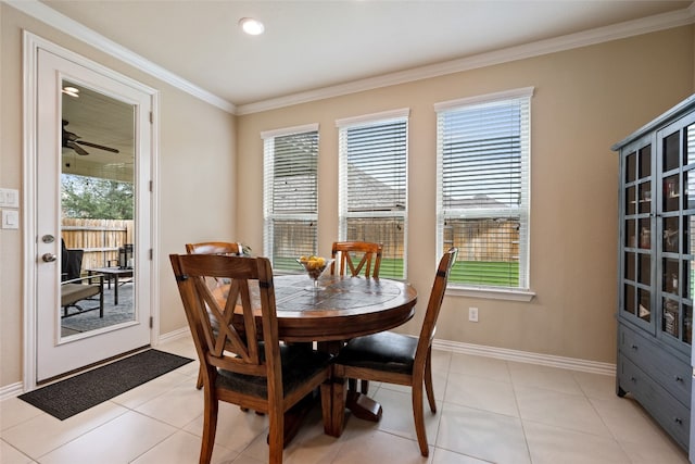 tiled dining area featuring a wealth of natural light, crown molding, and ceiling fan