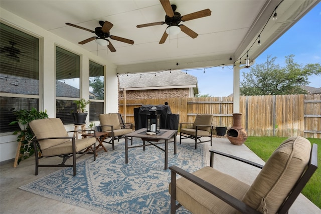 view of patio featuring outdoor lounge area, grilling area, and ceiling fan