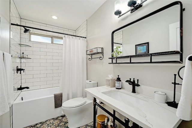 full bathroom with toilet, a sink, and shower / tub combo with curtain