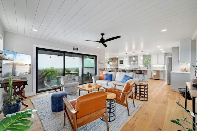 living area with recessed lighting, wood ceiling, ceiling fan, and light wood finished floors