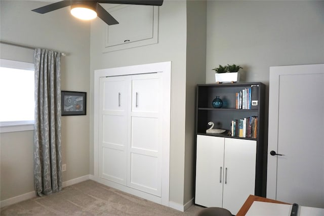 bedroom with light carpet and baseboards