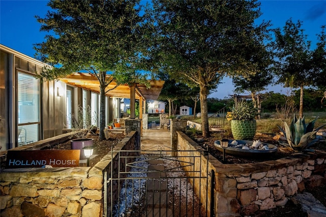 view of yard with an outdoor structure and a pergola