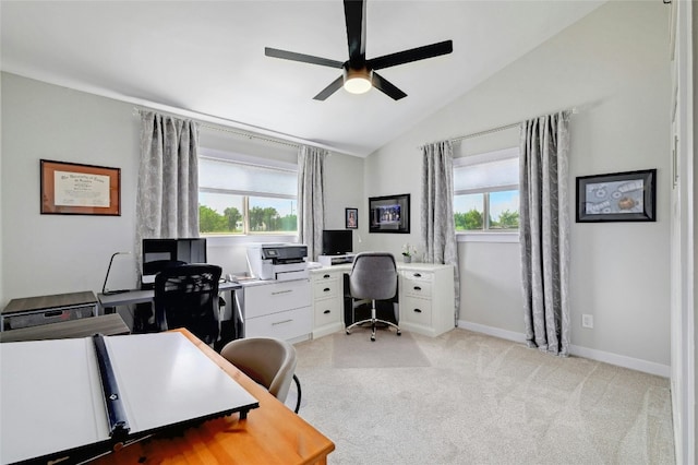 office featuring a ceiling fan, lofted ceiling, and baseboards