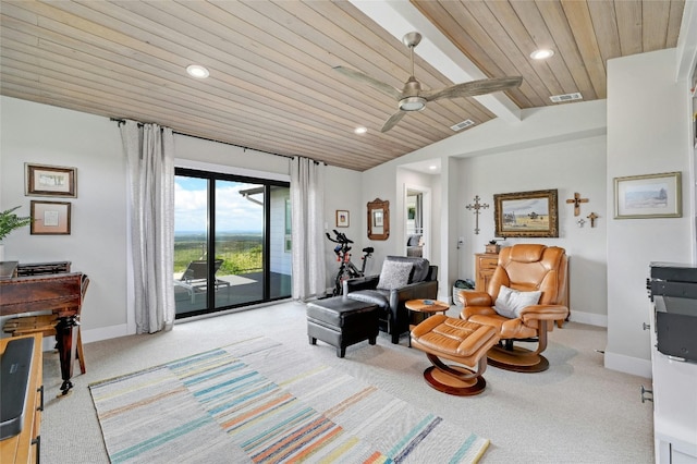 sitting room with lofted ceiling with beams, light colored carpet, visible vents, baseboards, and wood ceiling