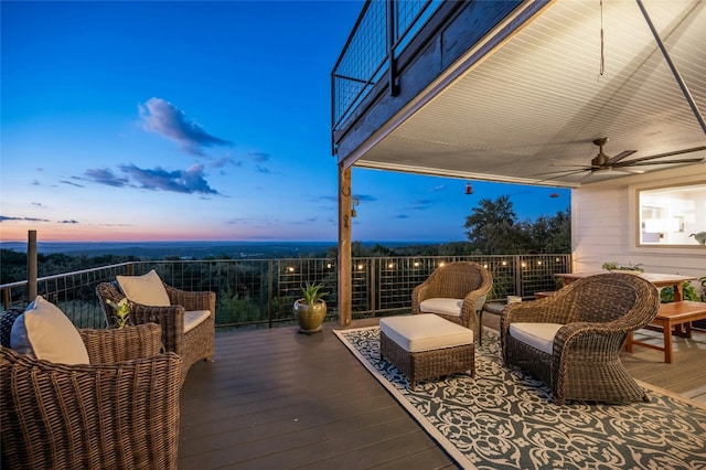 deck featuring ceiling fan and outdoor lounge area