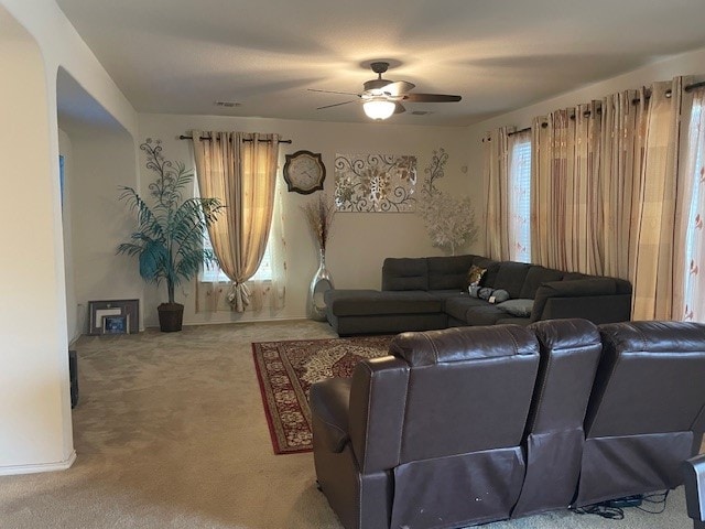 living room featuring ceiling fan and carpet floors