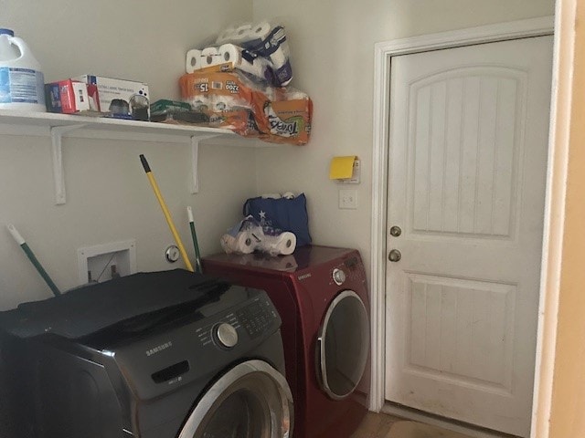 washroom featuring washer and clothes dryer