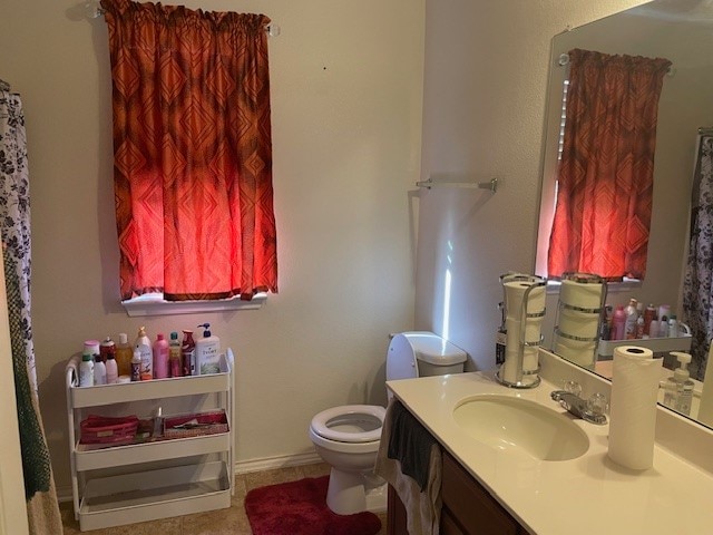 bathroom featuring vanity and toilet