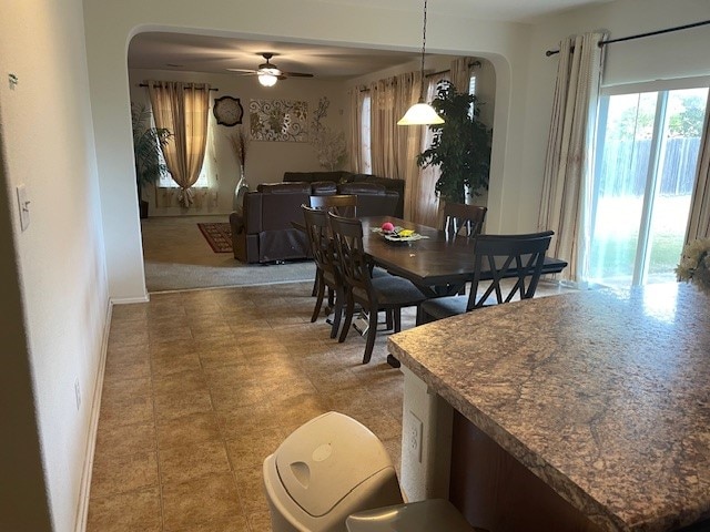 dining area with ceiling fan