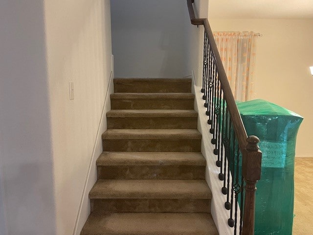 stairs featuring carpet