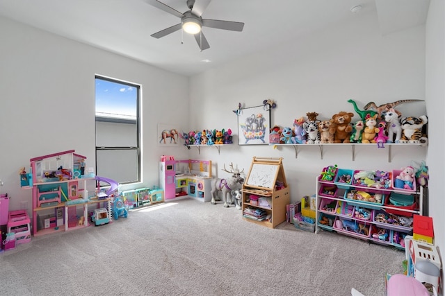 playroom featuring carpet and ceiling fan