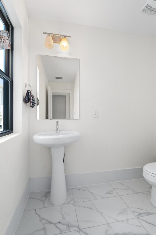 bathroom featuring toilet