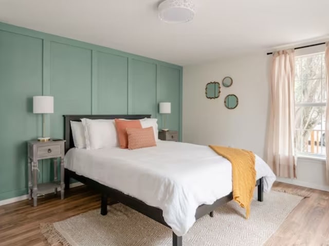 bedroom with light wood-type flooring