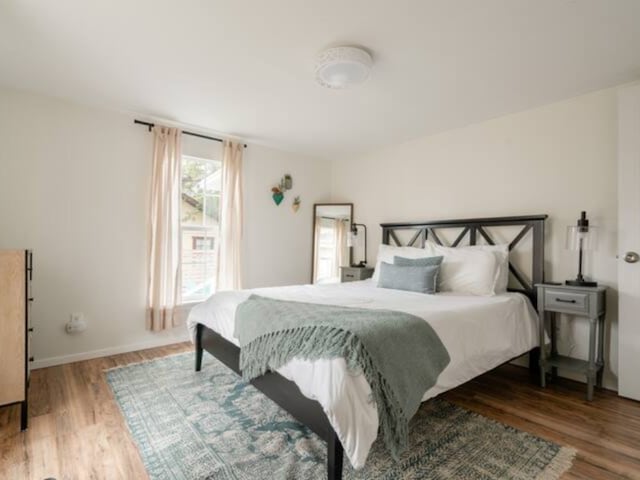 bedroom with wood-type flooring