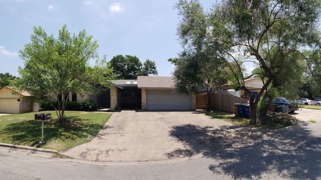 ranch-style house featuring a garage