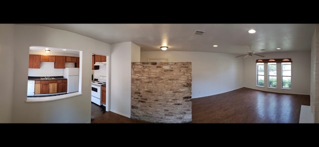 kitchen with dark hardwood / wood-style flooring, white appliances, vaulted ceiling, and ceiling fan