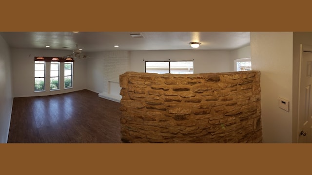 unfurnished living room with dark hardwood / wood-style flooring