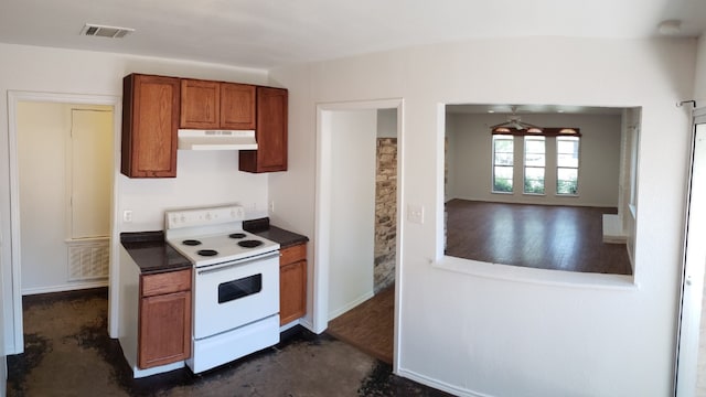 kitchen featuring dark hardwood / wood-style flooring, white range with electric cooktop, and ceiling fan