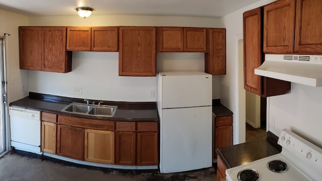 kitchen featuring range hood, white appliances, and sink