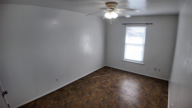 unfurnished room with ceiling fan