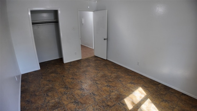 unfurnished bedroom featuring a closet