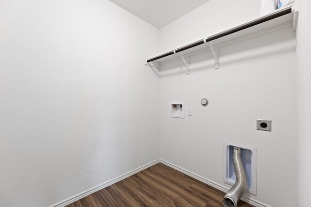 clothes washing area featuring washer hookup, electric dryer hookup, dark hardwood / wood-style floors, and gas dryer hookup