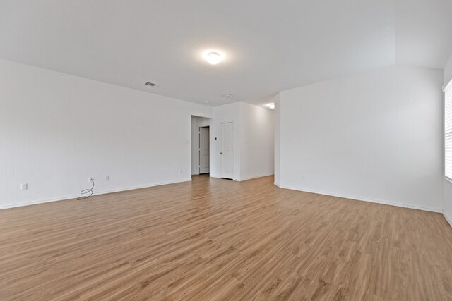 empty room with light hardwood / wood-style floors