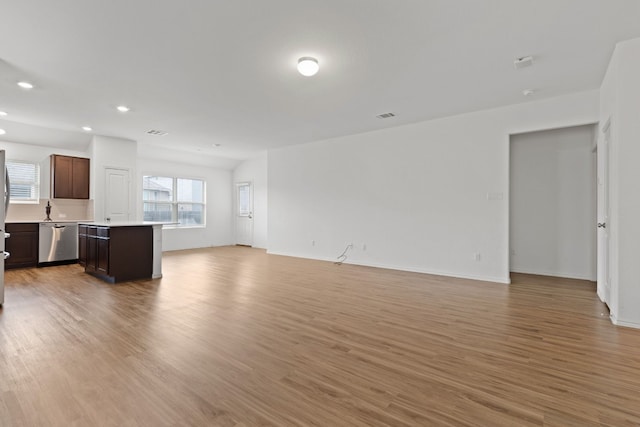 unfurnished living room featuring light hardwood / wood-style flooring