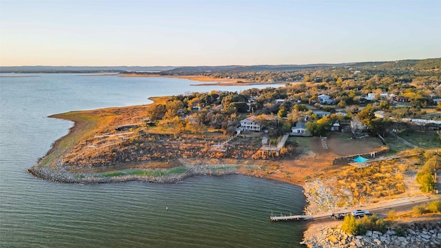 aerial view at dusk with a water view