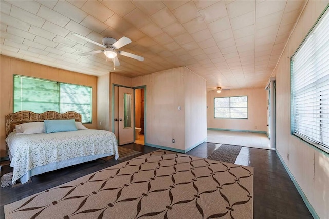 bedroom featuring ceiling fan and dark wood-type flooring